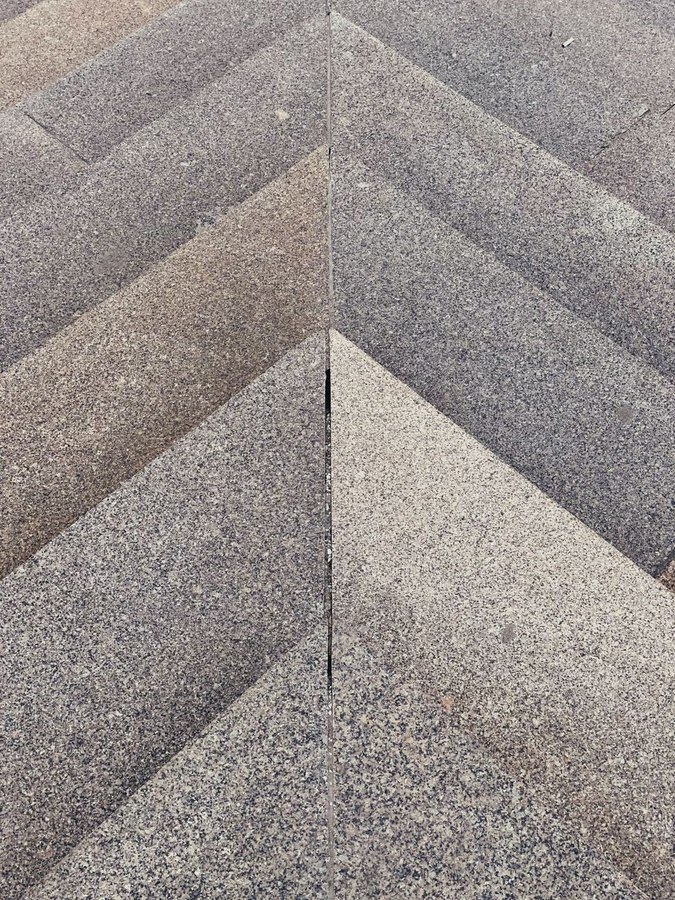 Close-up macro shot of parquet wood grain and sanding dust, showing the detail and craftsmanship involved in restoration work
